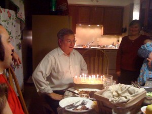Dad listens to the birthday song, and all those candles....