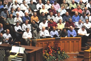 Men of the choir during a pause in the rehearsal.