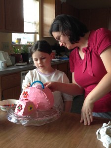 Mom and Rebekah prepare the birthday cake